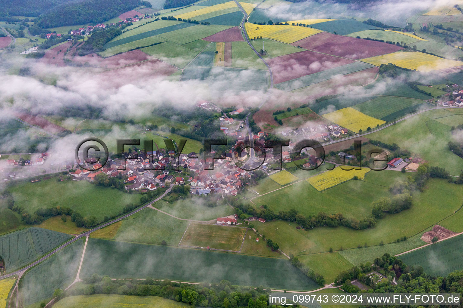 Under clouds in the district Prölsdorf in Rauhenebrach in the state Bavaria, Germany