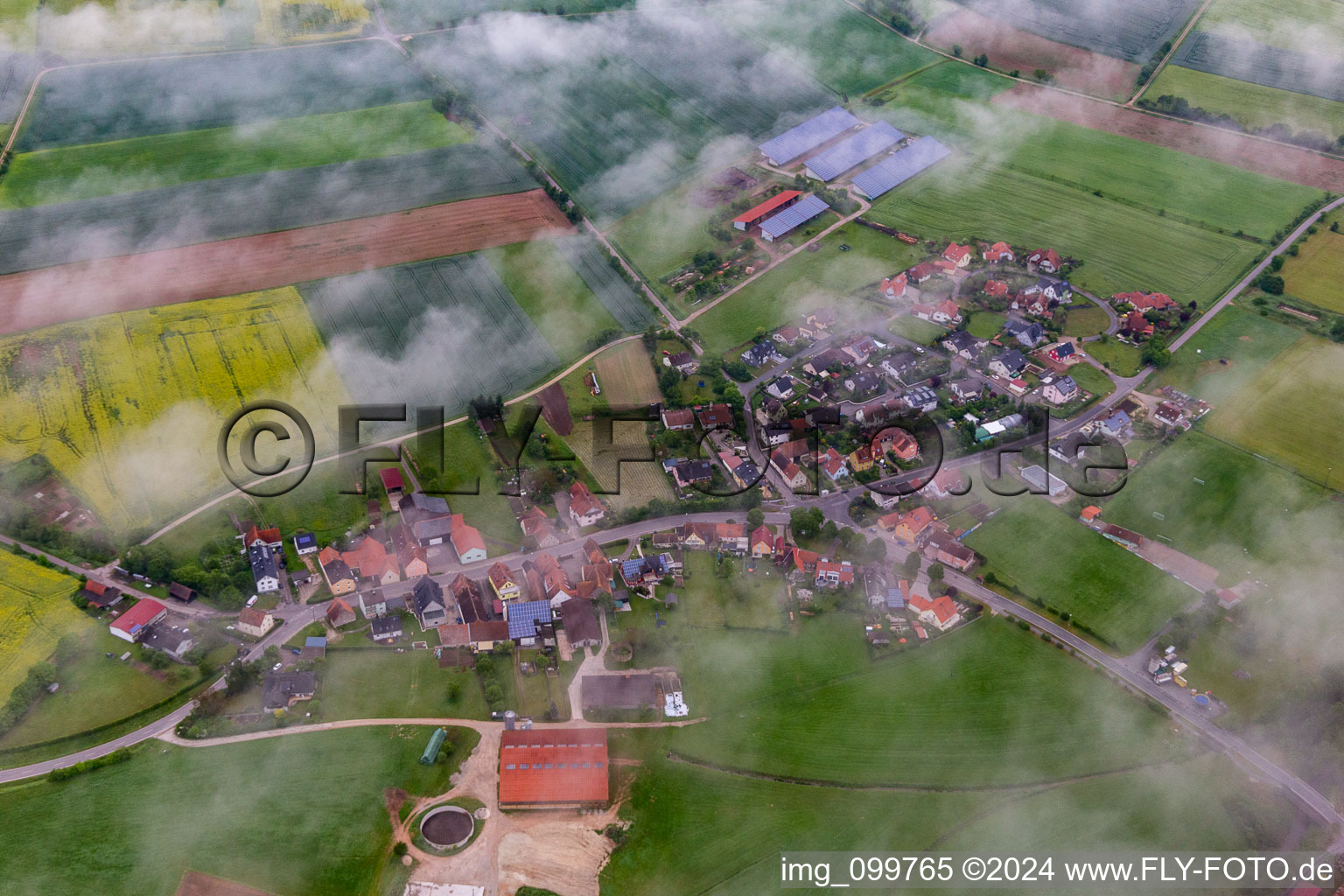 Place under clouds in the district Dietendorf in Burgebrach in the state Bavaria, Germany