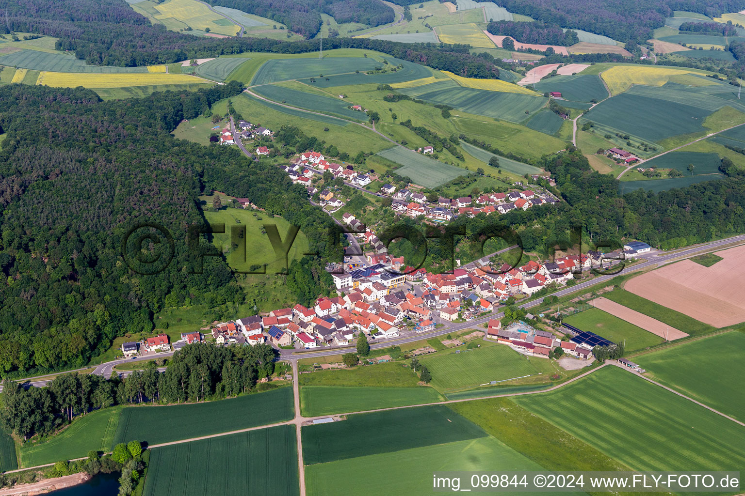 Aerial photograpy of Village - view on the edge of agricultural fields and farmland in the district Rossstadt in Eltmann in the state Bavaria, Germany