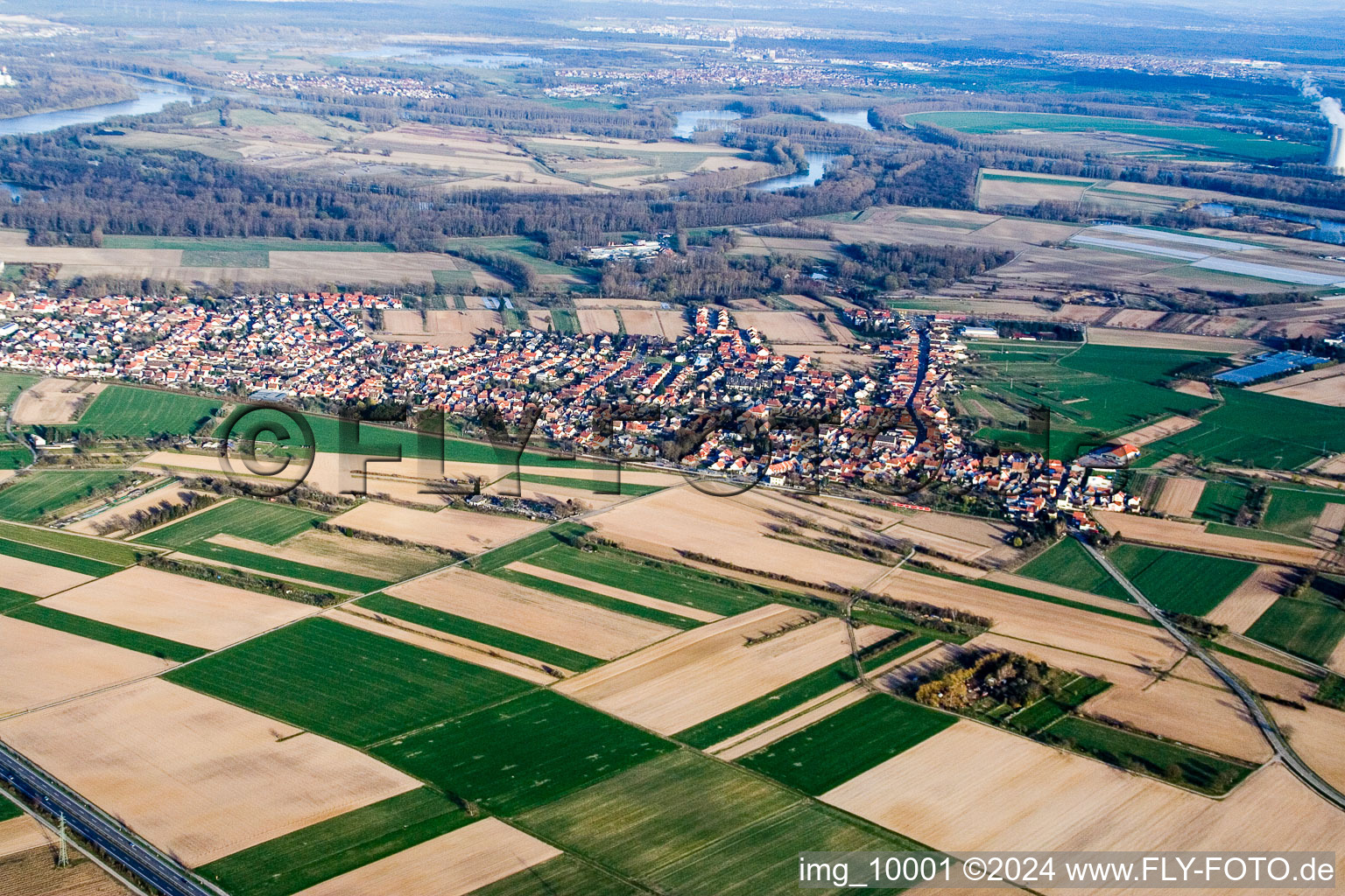 Village - view on the edge of agricultural fields and farmland in the district Heiligenstein in Roemerberg in the state Rhineland-Palatinate, Germany