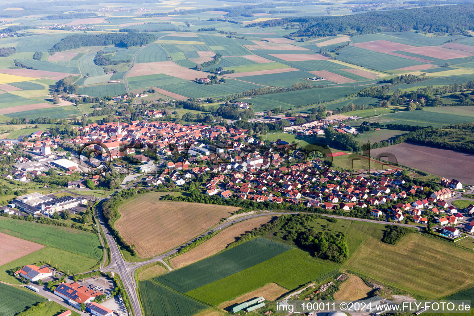 Village - view on the edge of agricultural fields and farmland in Stadtlauringen in the state Bavaria, Germany