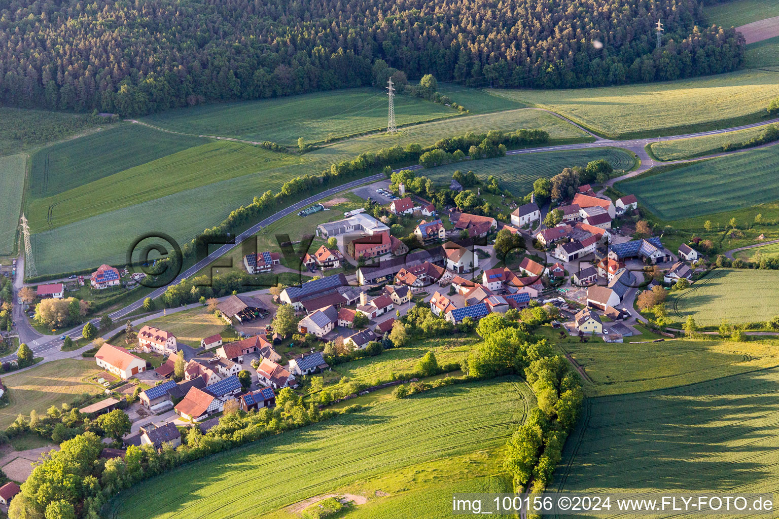 Village - view on the edge of agricultural fields and farmland in Salmsdorf in the state Bavaria, Germany