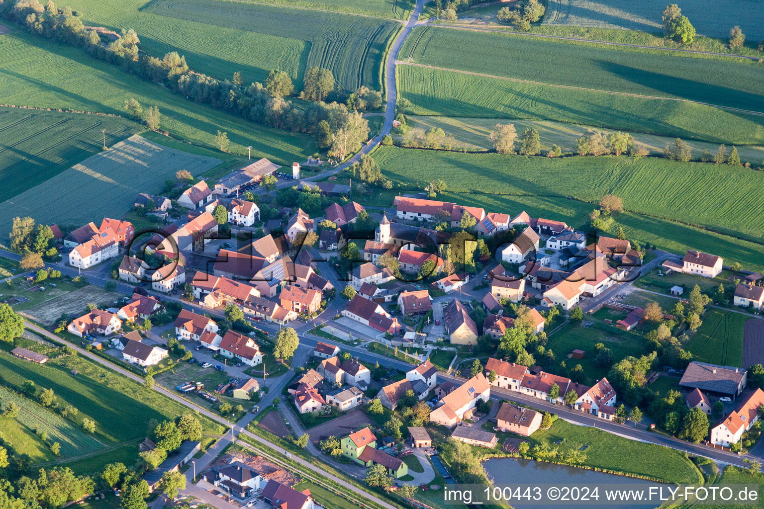 Village - view on the edge of agricultural fields and farmland in the district Moenchherrnsdorf in Burgebrach in the state Bavaria, Germany