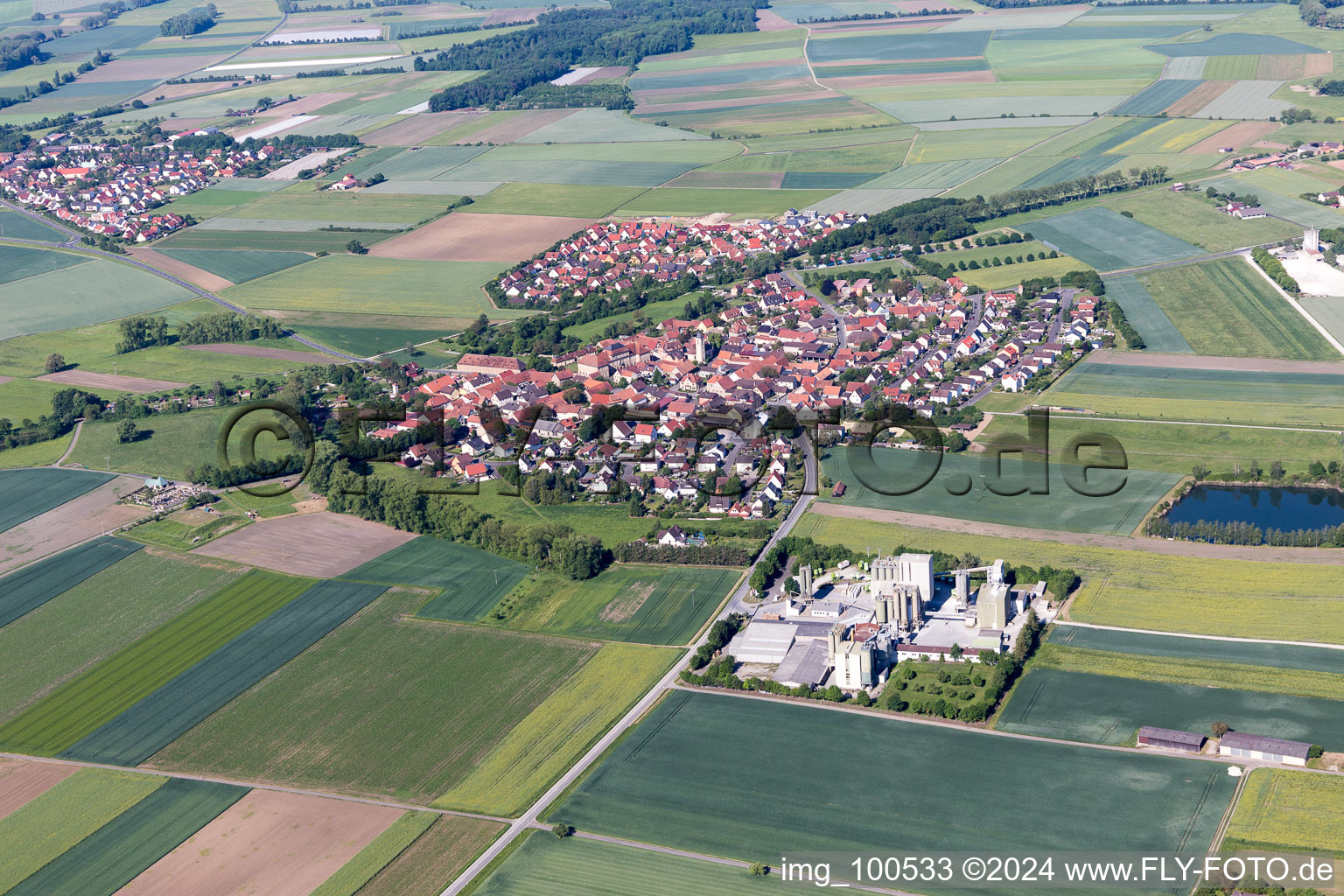 Aerial view of Village - view on the edge of agricultural fields and farmland in Sulzheim in the state Bavaria, Germany