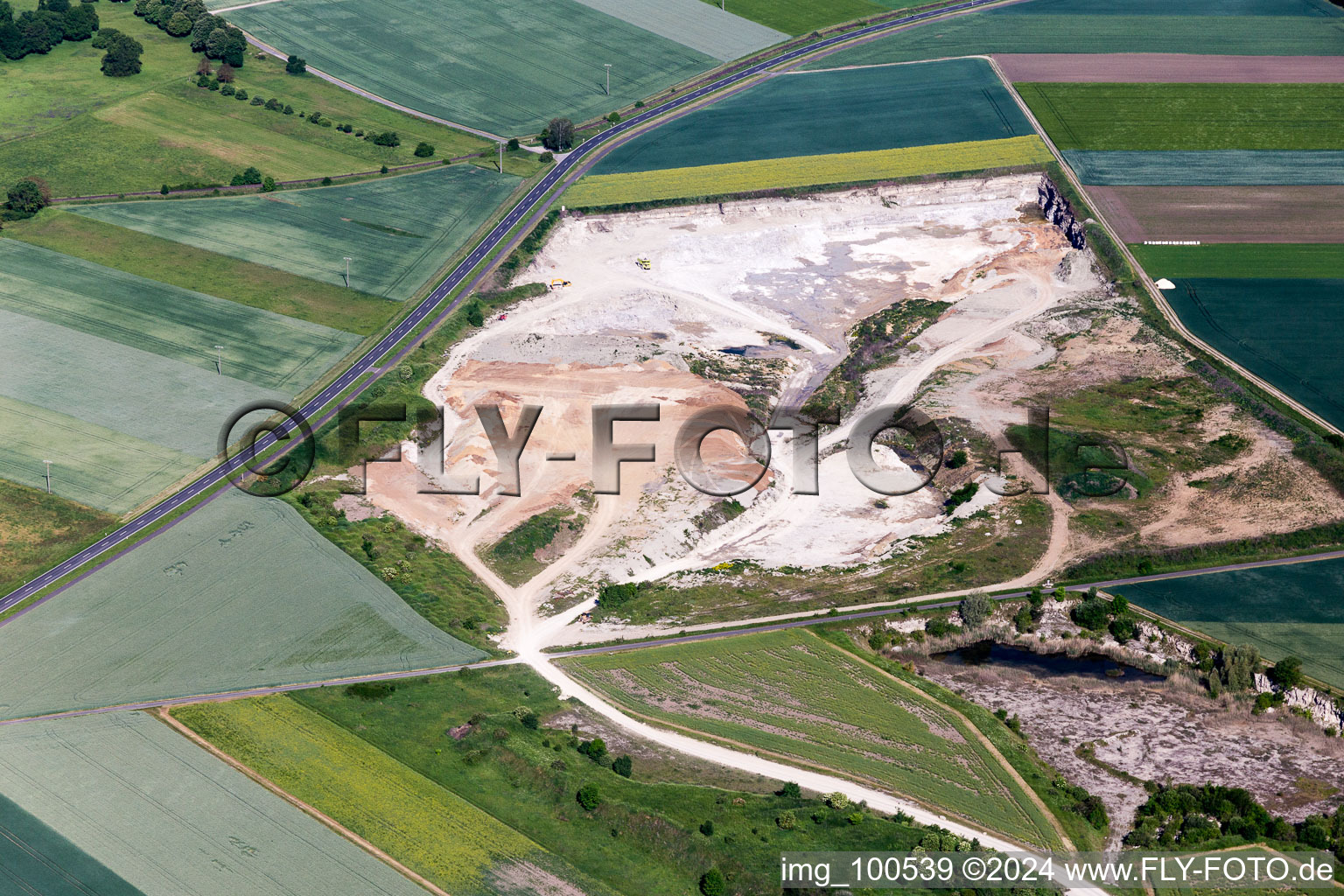 Aerial photograpy of Site and tailings area of the gravel mining of Concrete-manufacturer in Sulzheim in the state Bavaria, Germany