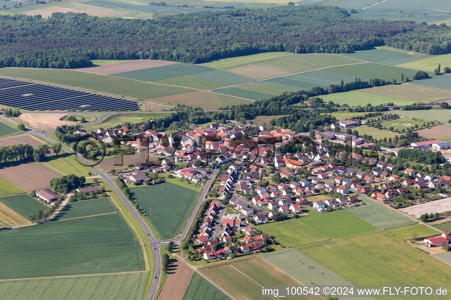 Village - view on the edge of agricultural fields and farmland in Alitzheim in the state Bavaria, Germany