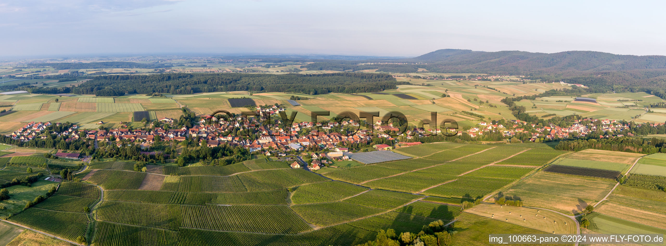 Panoramic perspective Village - view on the edge of agricultural fields and farmland in Steinseltz in Grand Est, France