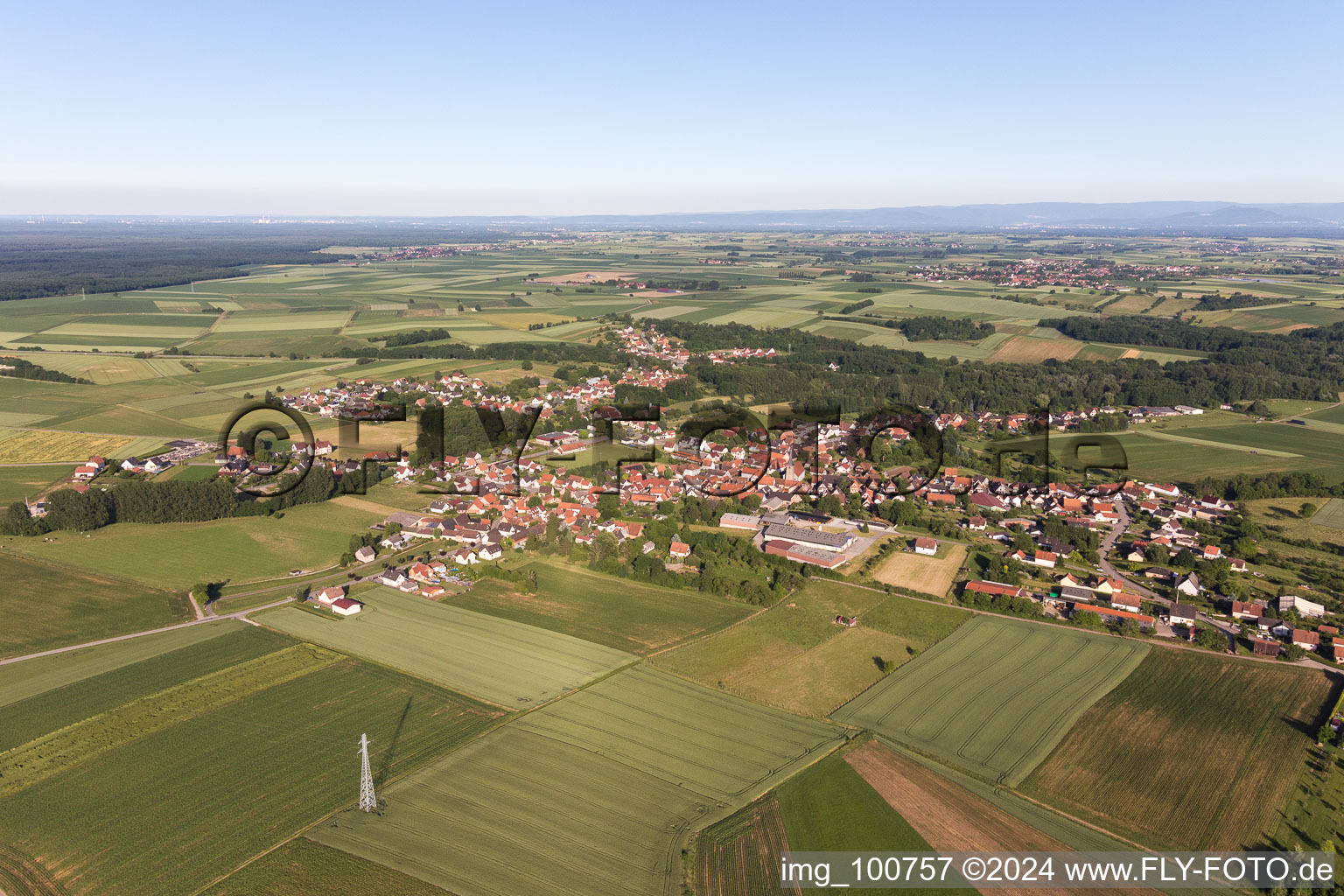 Aerial photograpy of Village - view on the edge of agricultural fields and farmland in Riedseltz in Grand Est, France