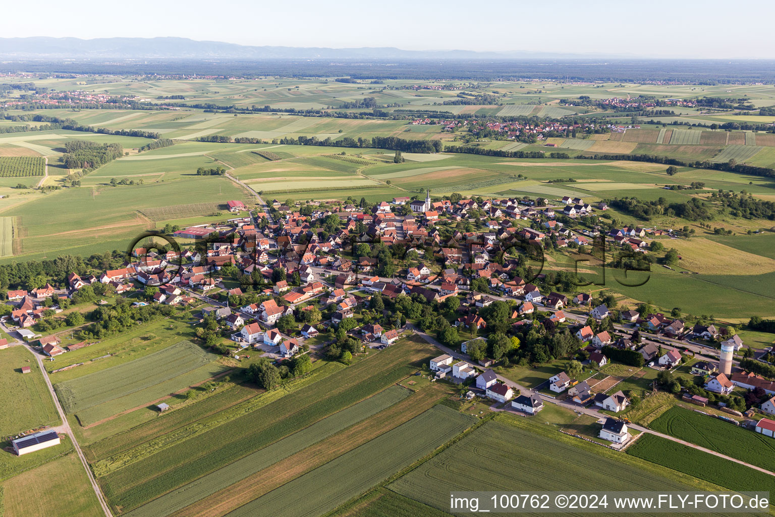 Village - view on the edge of agricultural fields and farmland in Schoenenbourg in Grand Est, France