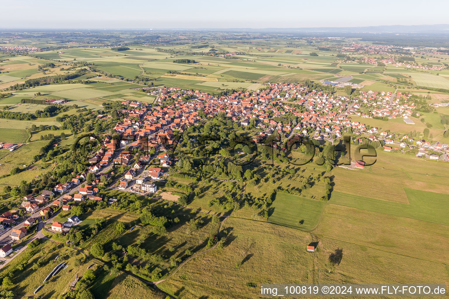 Village - view on the edge of agricultural fields and farmland in Surbourg in Grand Est, France