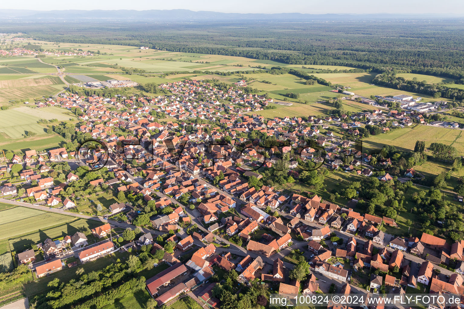 Aerial view of Village - view on the edge of agricultural fields and farmland in Surbourg in Grand Est, France