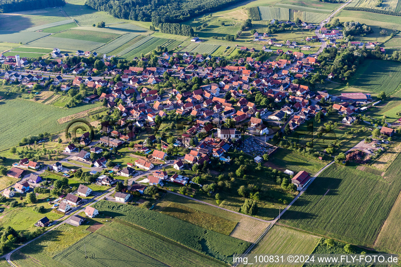 Aerial view of Village - view on the edge of agricultural fields and farmland in Schoenenbourg in Grand Est, France