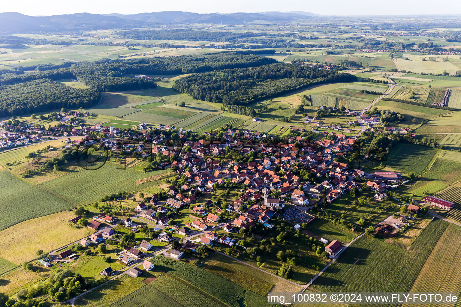 Aerial photograpy of Village - view on the edge of agricultural fields and farmland in Schoenenbourg in Grand Est, France