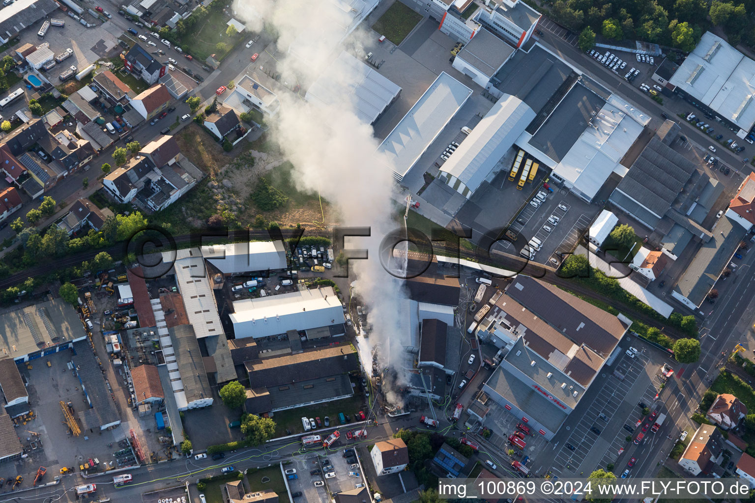 Smoke and flames during the fire fighting to fire of a storage all for antiqities in the Werkstrasse in Speyer in the state Rhineland-Palatinate, Germany out of the air