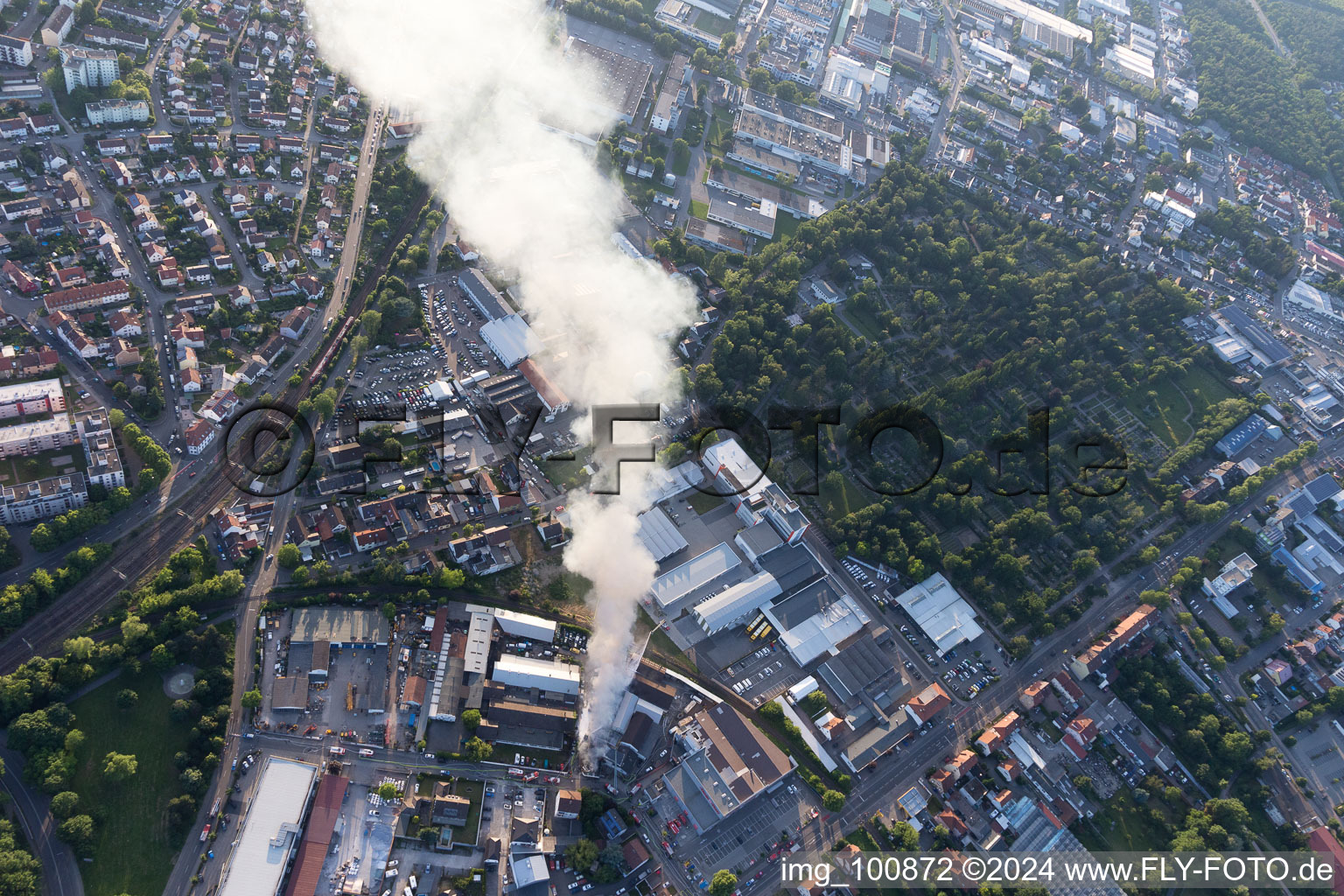 Bird's eye view of Smoke and flames during the fire fighting to fire of a storage all for antiqities in the Werkstrasse in Speyer in the state Rhineland-Palatinate, Germany