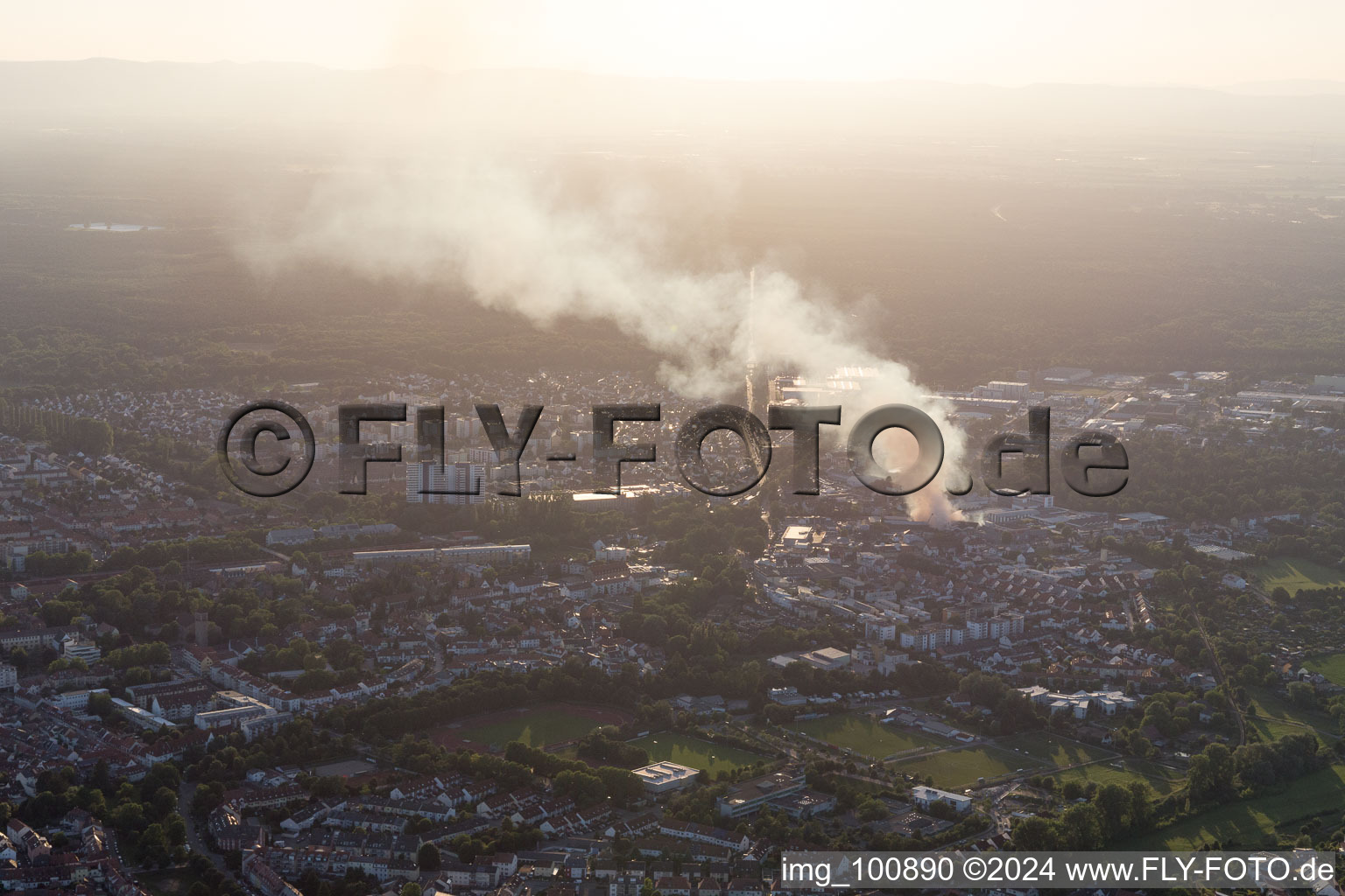 Smoke and flames during the fire fighting to fire of a storage all for antiqities in the Werkstrasse in Speyer in the state Rhineland-Palatinate, Germany from the drone perspective