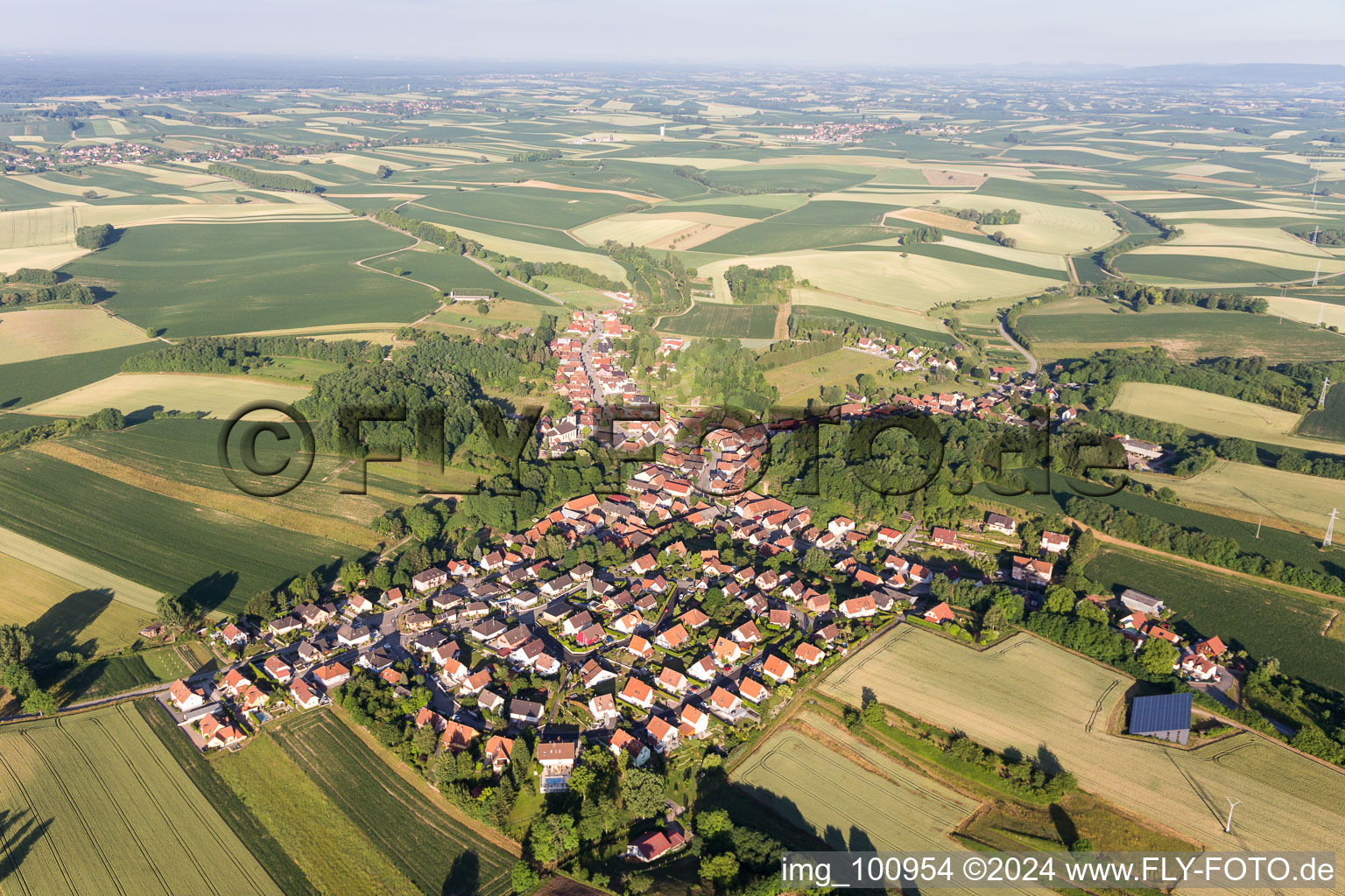 Village - view on the edge of agricultural fields and farmland in Neewiller-pres-Lauterbourg in Grand Est, France