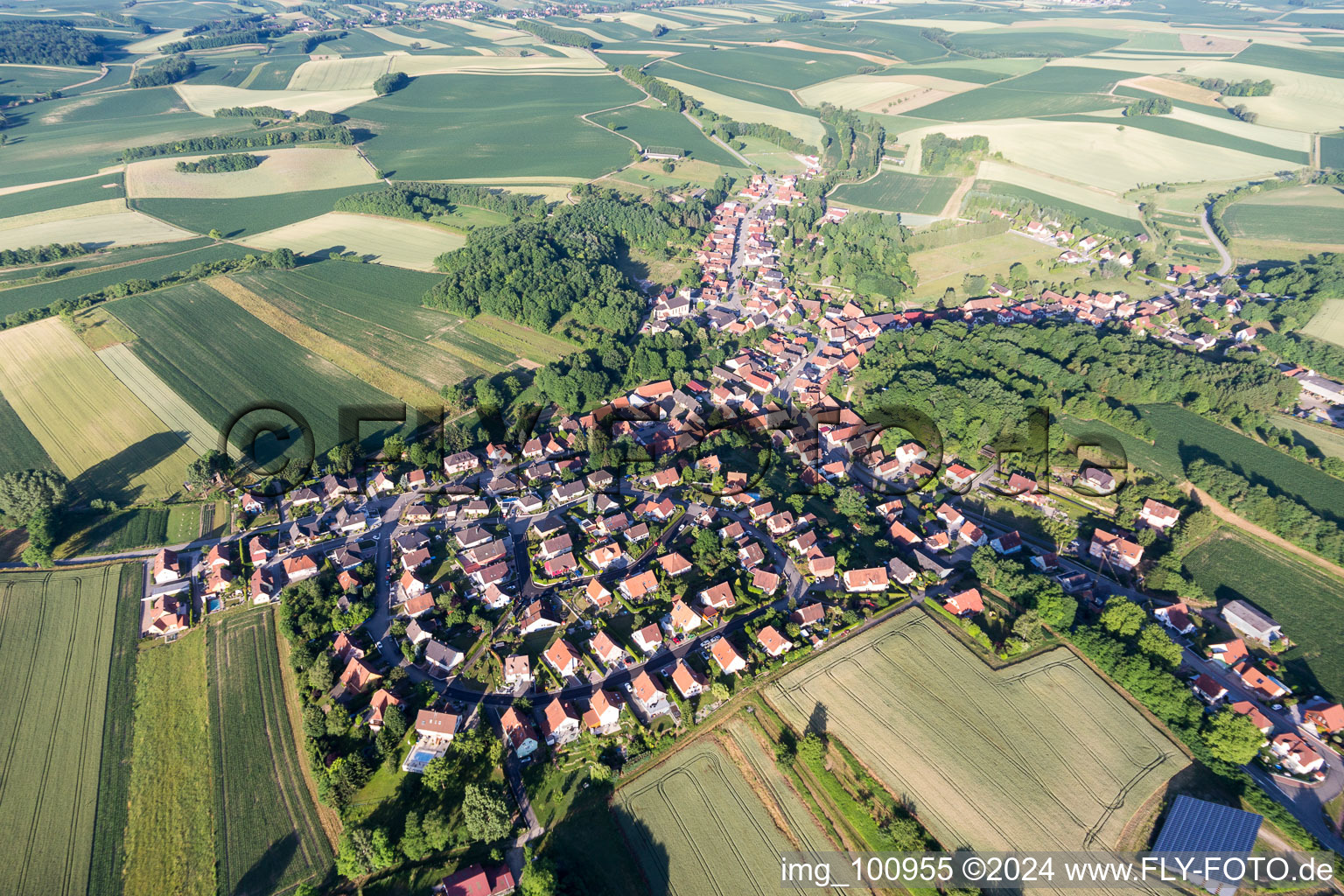 Aerial view of Village - view on the edge of agricultural fields and farmland in Neewiller-pres-Lauterbourg in Grand Est, France