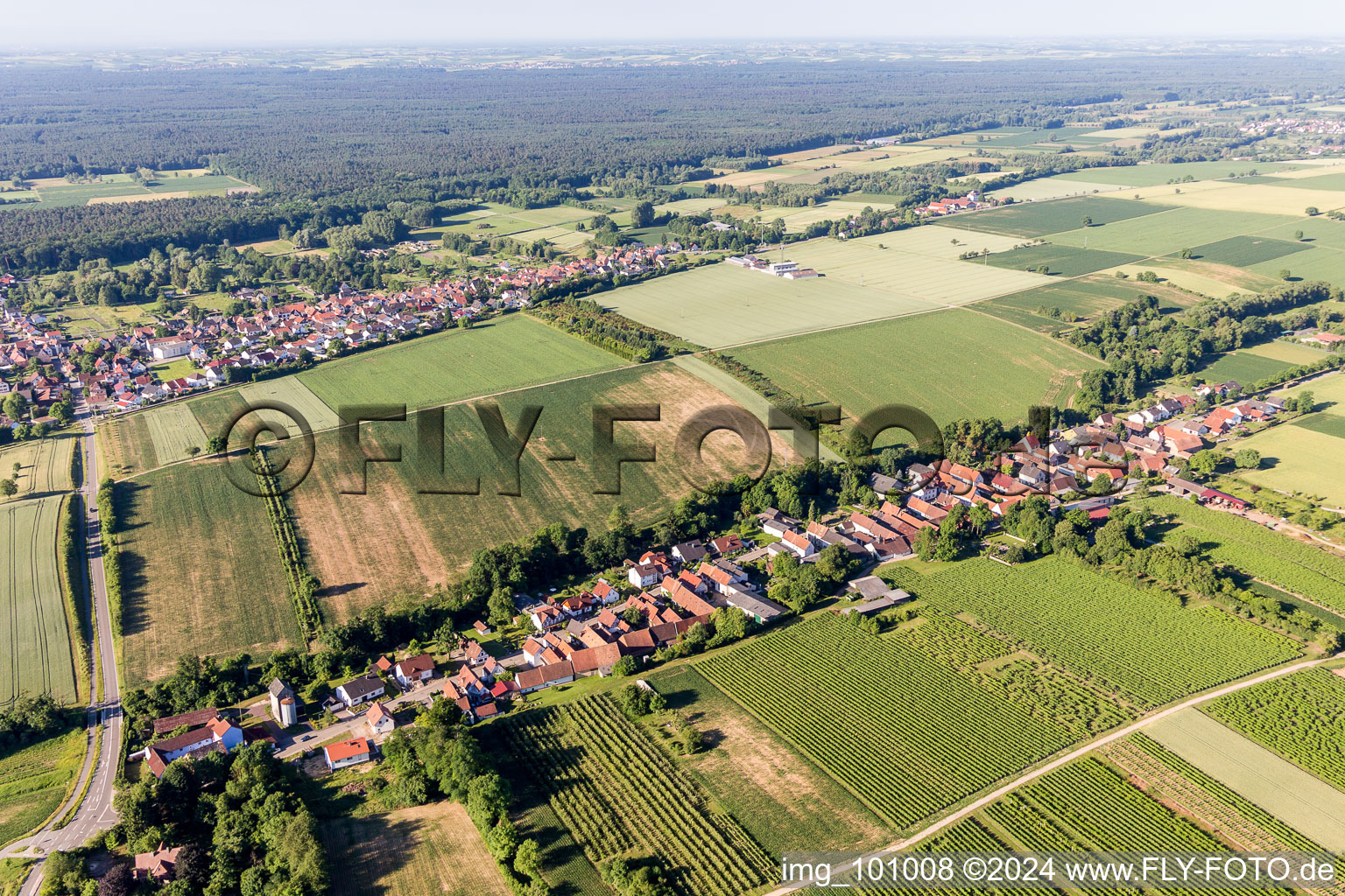 Village - view on the edge of agricultural fields and farmland in Vollmersweiler in the state Rhineland-Palatinate, Germany