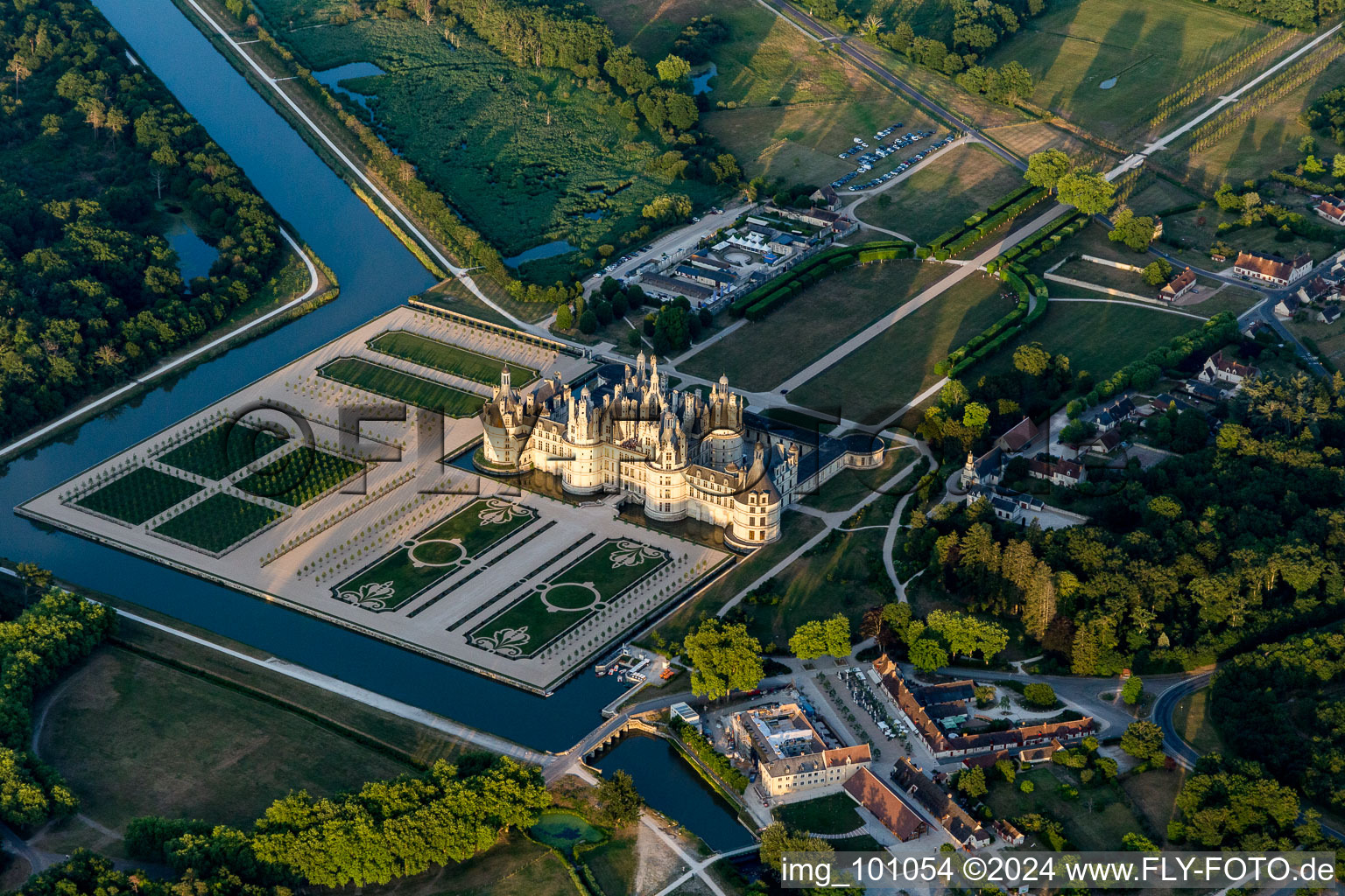 Chateau de Chambord with castle park and canal Cosson in Chambord in the state Loir et Cher, France