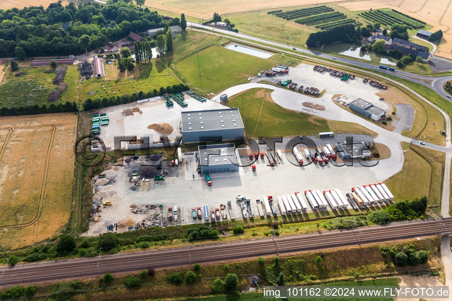 Warehouse complex-building in the industrial area fuer road construction Chavigny Travaux Publics in Saint-Amand-Longpre in Centre-Val de Loire, France