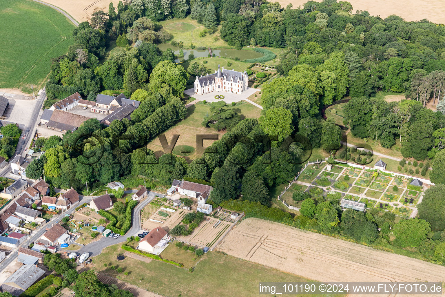 Buildings and park of the castle in Saint-Cyr-du-Gault in Centre-Val de Loire, France out of the air