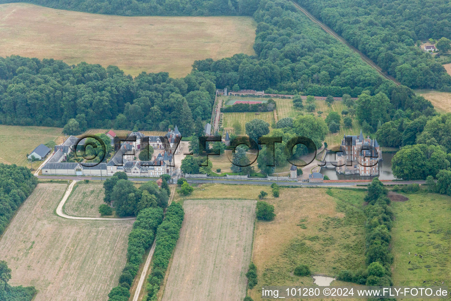 Aerial view of Building and castle park systems of water castle Chateau de Combreux in Combreux in Centre-Val de Loire, France