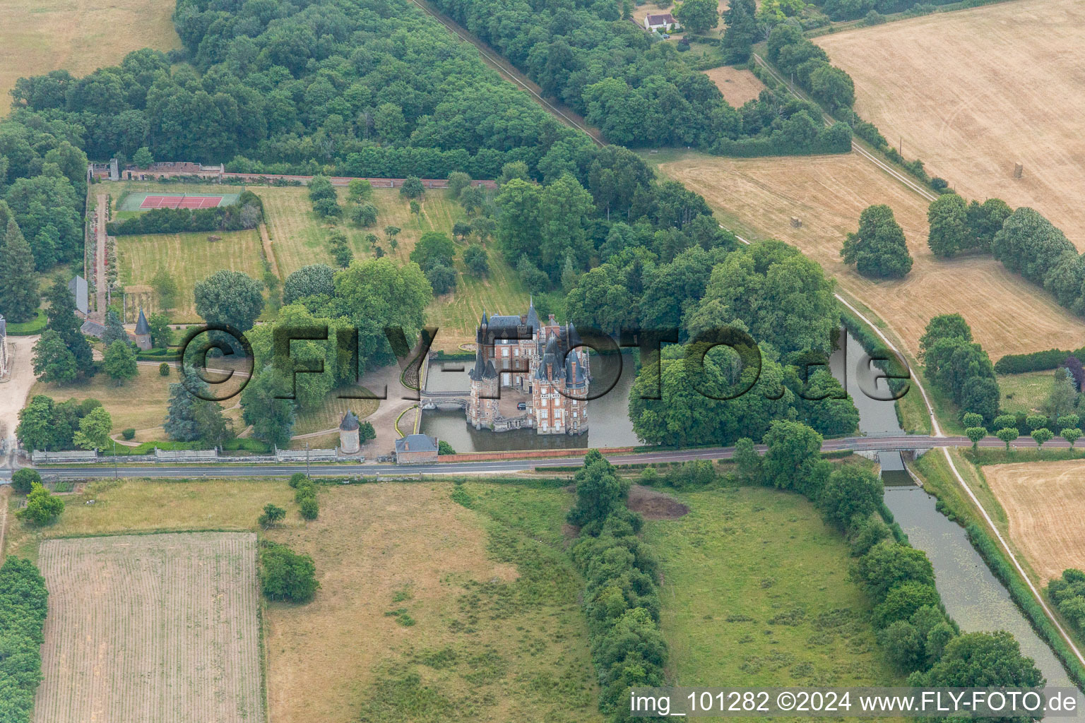 Oblique view of Building and castle park systems of water castle Chateau de Combreux in Combreux in Centre-Val de Loire, France