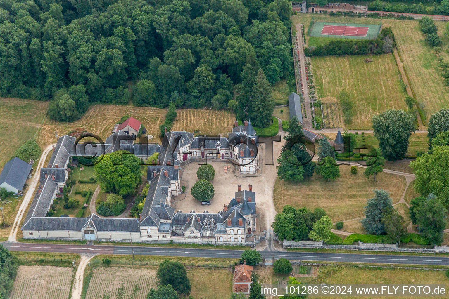 Building and castle park systems of water castle Chateau de Combreux in Combreux in Centre-Val de Loire, France from the plane