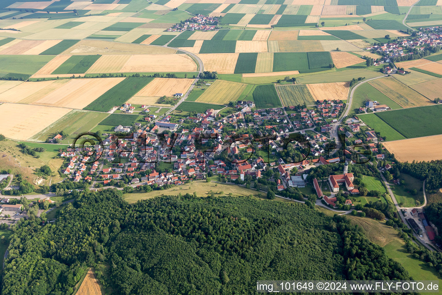 Village - view on the edge of agricultural fields and farmland in Moenchsdeggingen in the state Bavaria, Germany