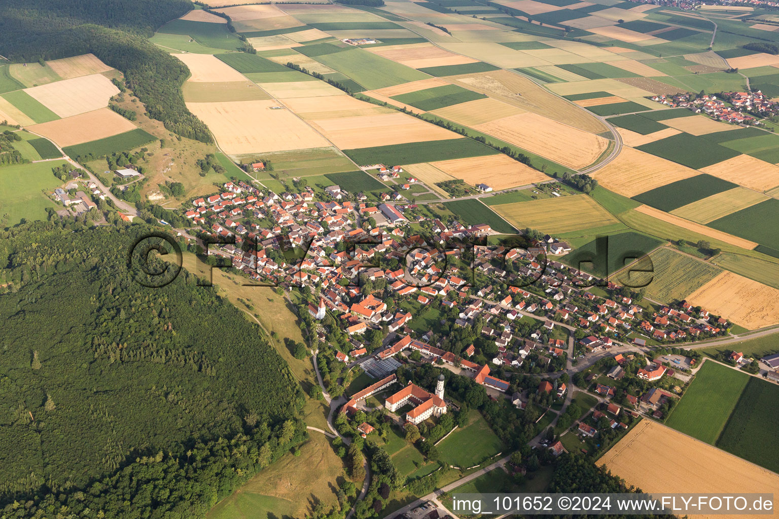 Aerial view of Village - view on the edge of agricultural fields and farmland in Moenchsdeggingen in the state Bavaria, Germany