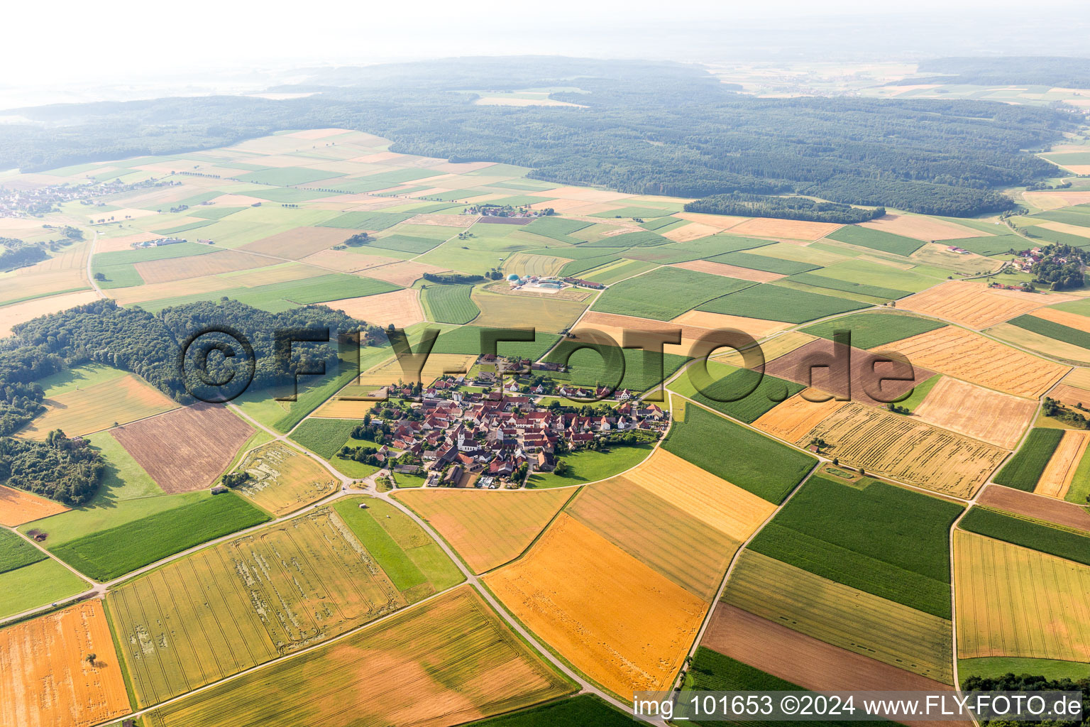 Village - view on the edge of agricultural fields and farmland in Moenchsdeggingen in the state Bavaria, Germany