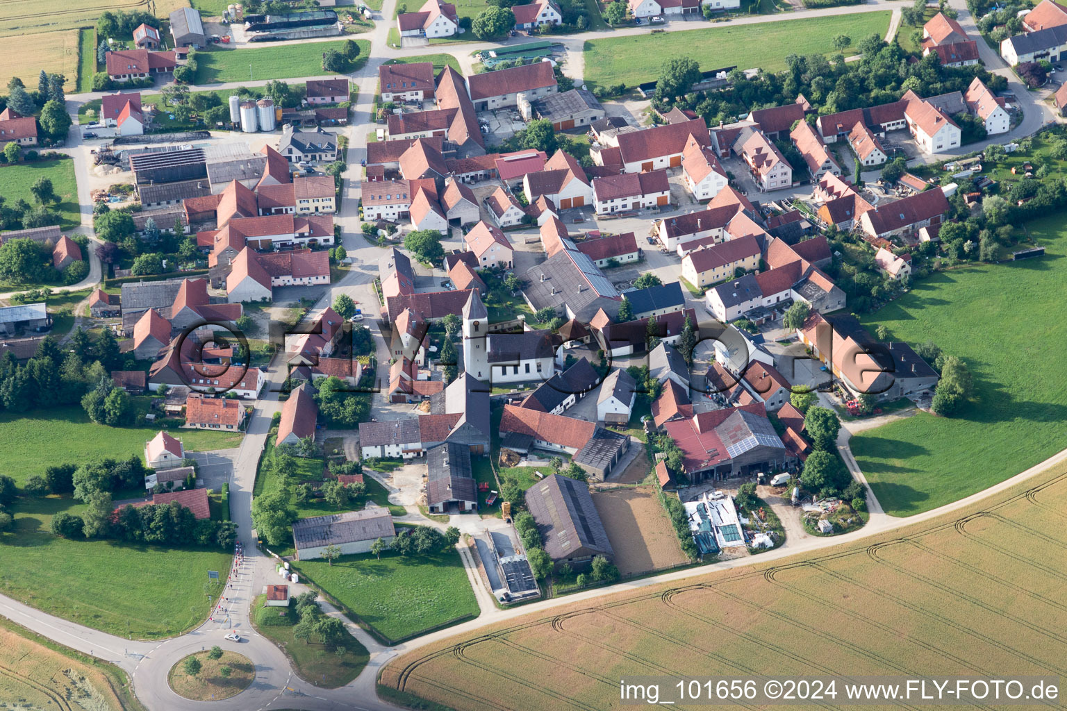 Aerial view of Village - view on the edge of agricultural fields and farmland in Moenchsdeggingen in the state Bavaria, Germany