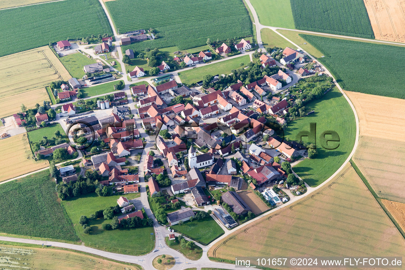 Aerial photograpy of Village - view on the edge of agricultural fields and farmland in Moenchsdeggingen in the state Bavaria, Germany