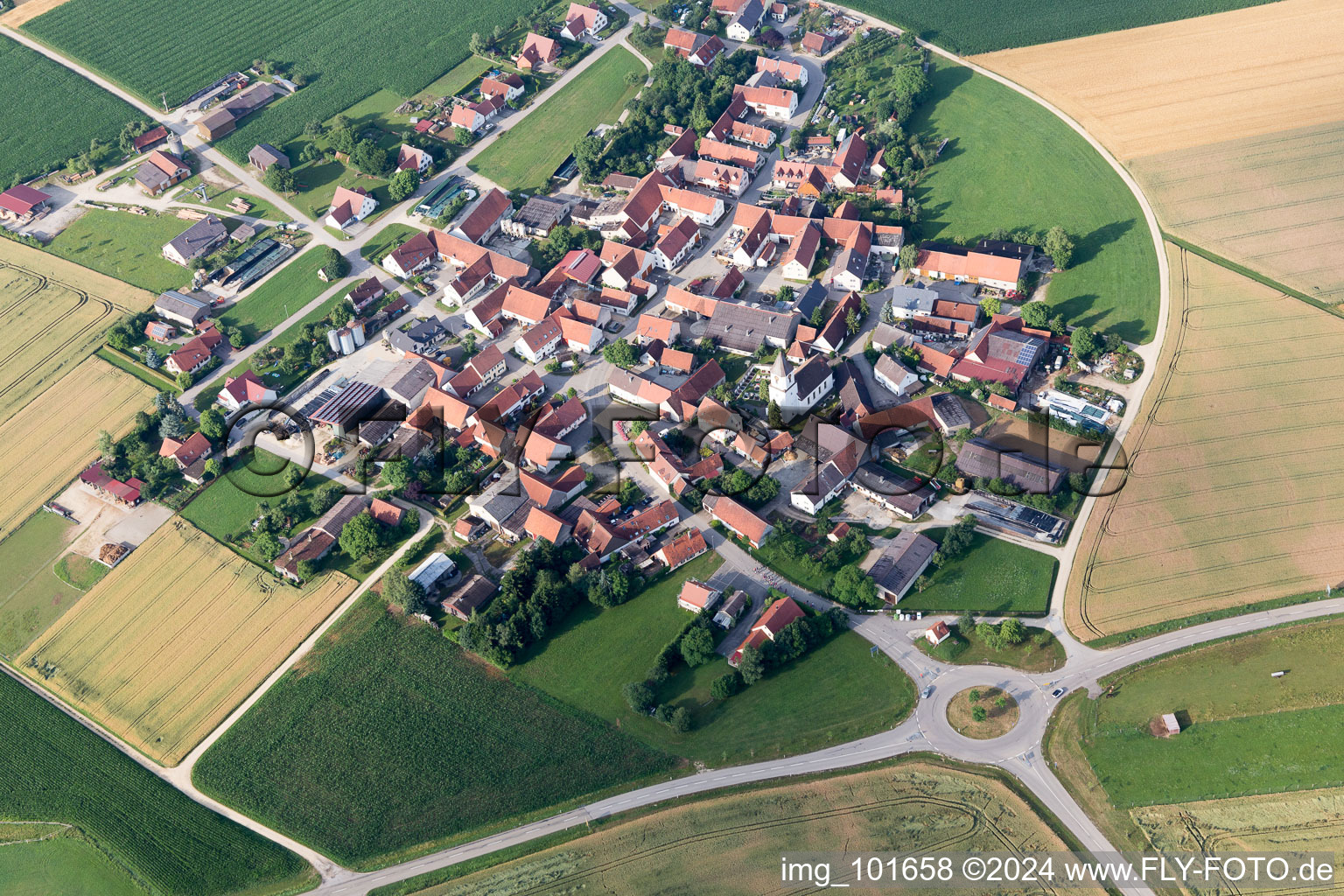 Aerial photograpy of Village - view on the edge of agricultural fields and farmland in Moenchsdeggingen in the state Bavaria, Germany