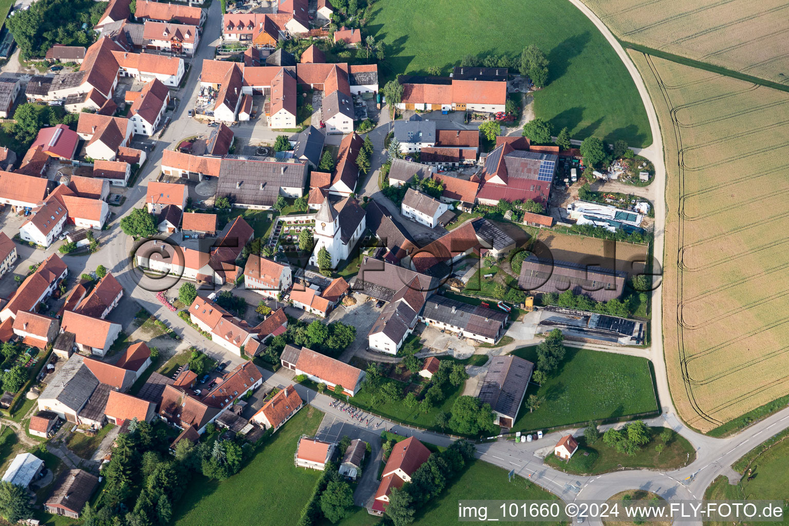 Oblique view of Village - view on the edge of agricultural fields and farmland in Moenchsdeggingen in the state Bavaria, Germany