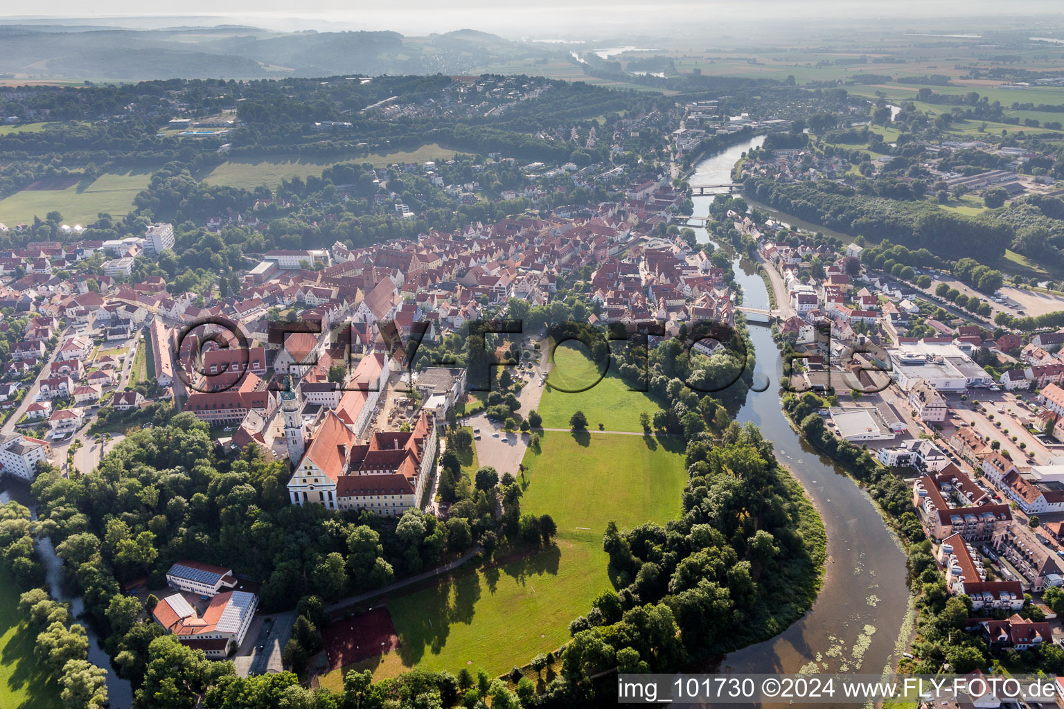 Aerial photograpy of Complex of buildings of the monastery Heilig Kreuz in front of Ried island in Donauwoerth in the state Bavaria, Germany