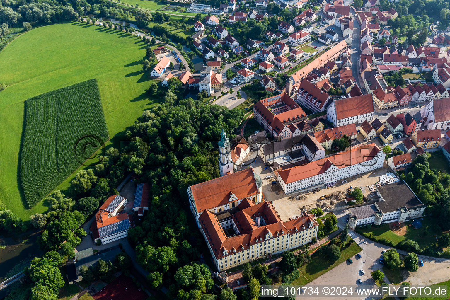 Complex of buildings of the monastery Heilig Kreuz in front of Ried island in Donauwoerth in the state Bavaria, Germany from above