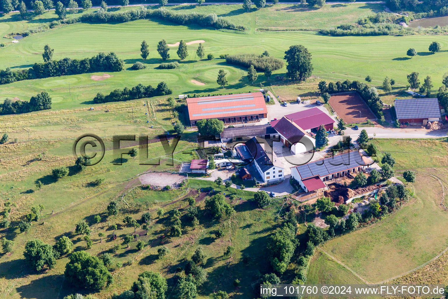 Farm near golf club on the edge of cultivated fields in the district Schiesserhof in Donauwoerth in the state Bavaria, Germany