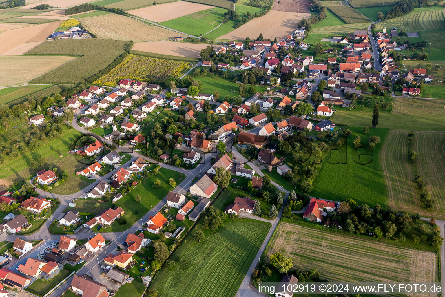 Village - view on the edge of agricultural fields and farmland in Voellkofen in the state Baden-Wurttemberg, Germany