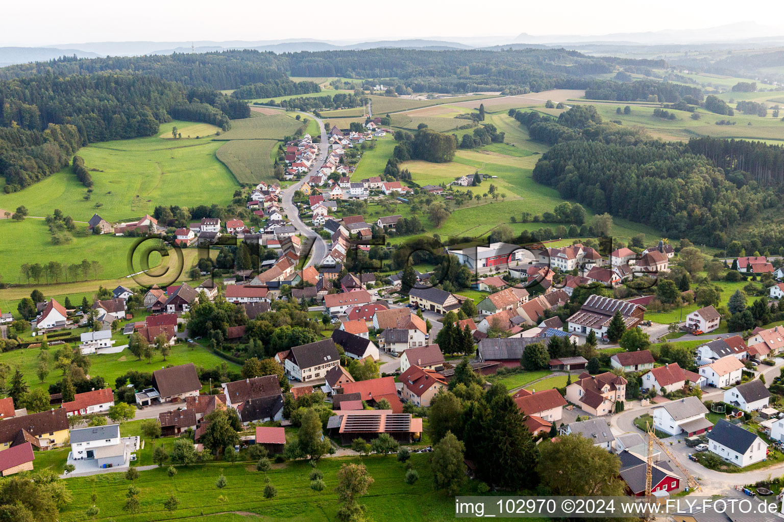 Aerial view of Village - view on the edge of agricultural fields and farmland in Zoznegg in the state Baden-Wurttemberg, Germany