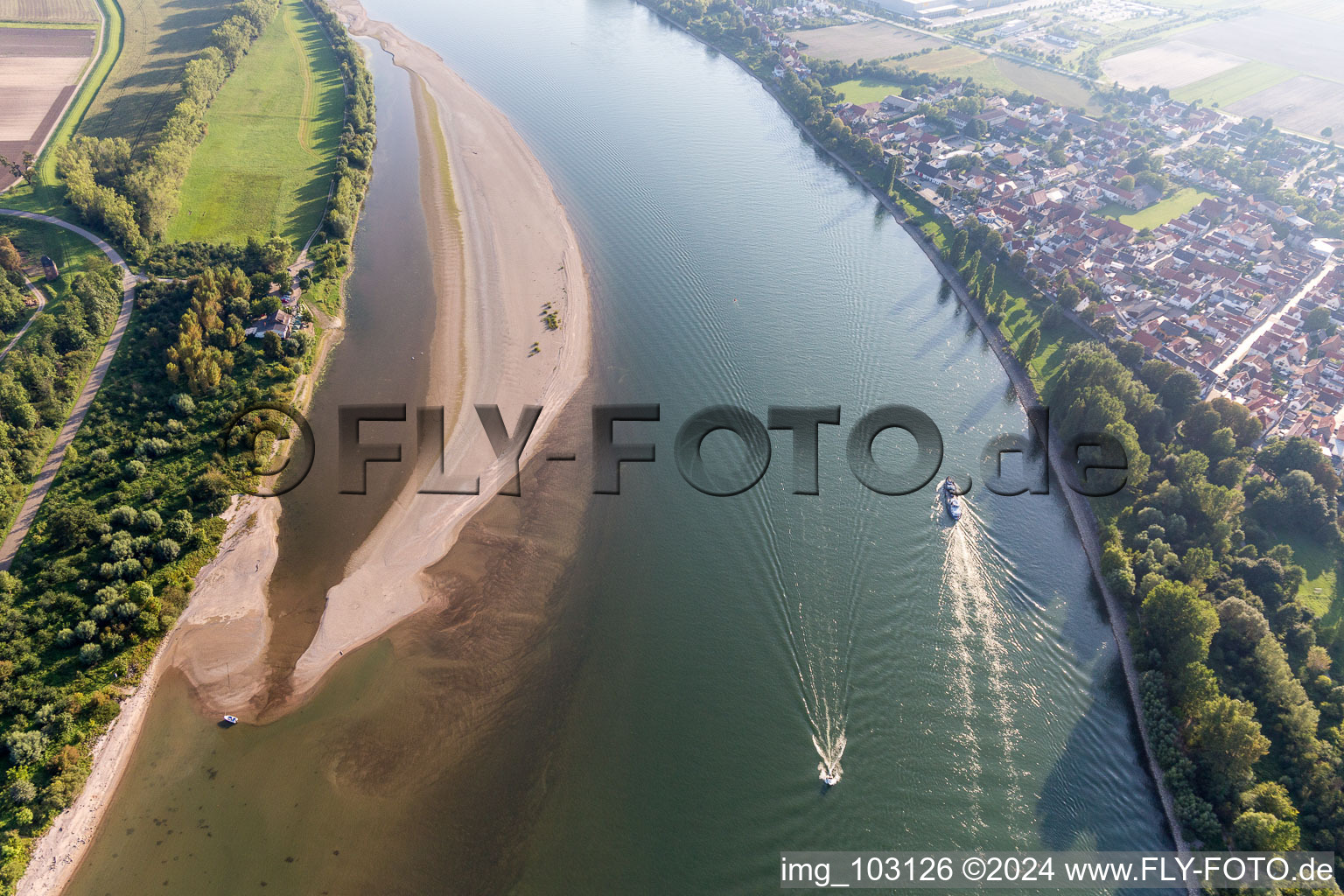 Sandbank- land area with sport boats at the shore of the Rhine river in the district Rheinduerkheim in Worms in the state Rhineland-Palatinate, Germany