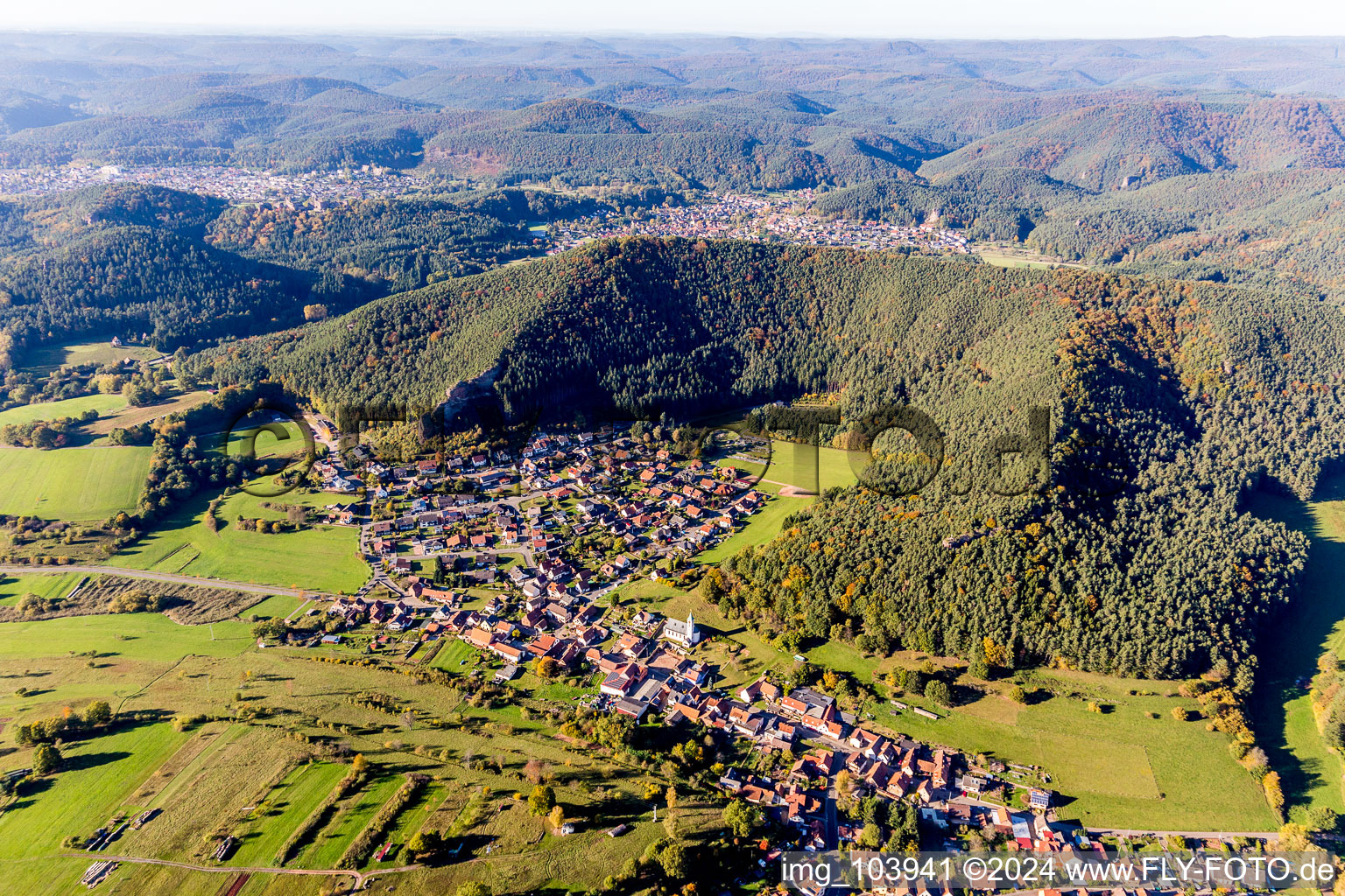 Village - view on the edge of agricultural fields and farmland in Schindhard in the state Rhineland-Palatinate, Germany