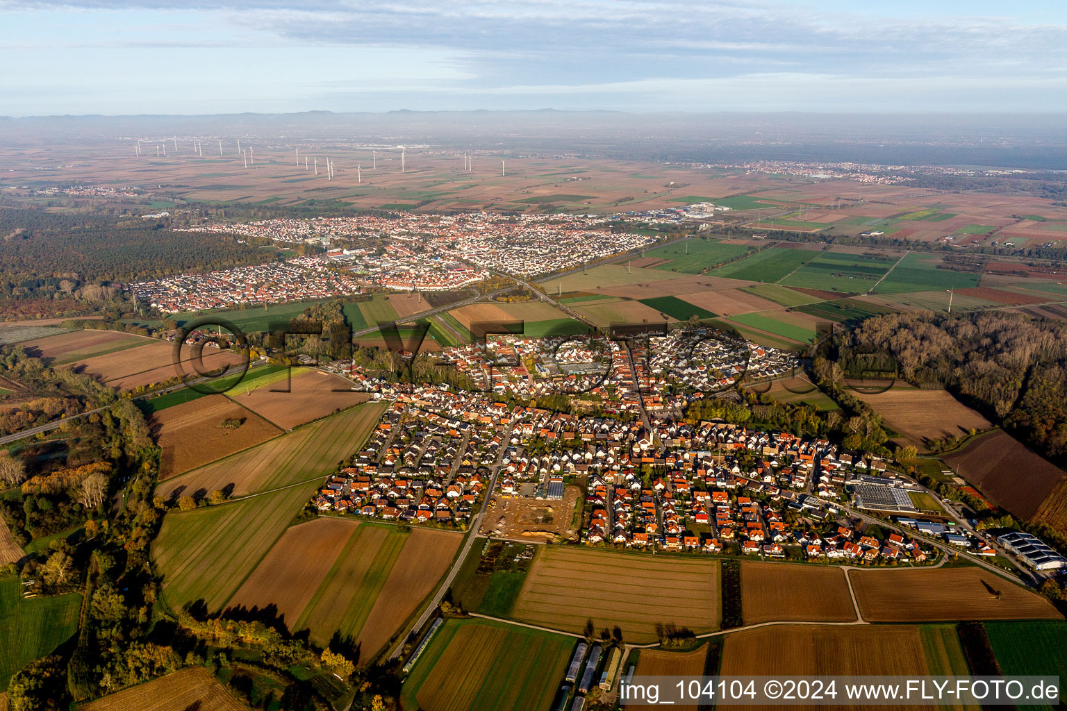 Village - view on the edge of agricultural fields and farmland in front of Ruelzheim in Kuhardt in the state Rhineland-Palatinate, Germany