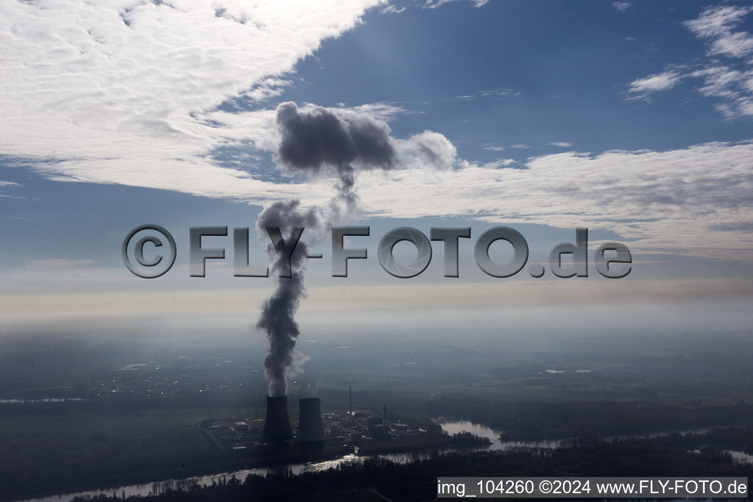 Aerial view of Clouds over the cooling tower of the NPP nuclear power plant of EnBW Kernkraft GmbH, Kernkraftwerk Philippsburg on an Island in the river rhine in Philippsburg in the state Baden-Wurttemberg, Germany