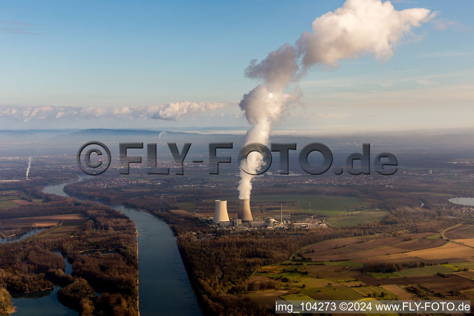 Aerial photograpy of Clouds over the cooling tower of the NPP nuclear power plant of EnBW Kernkraft GmbH, Kernkraftwerk Philippsburg on an Island in the river rhine in Philippsburg in the state Baden-Wurttemberg, Germany