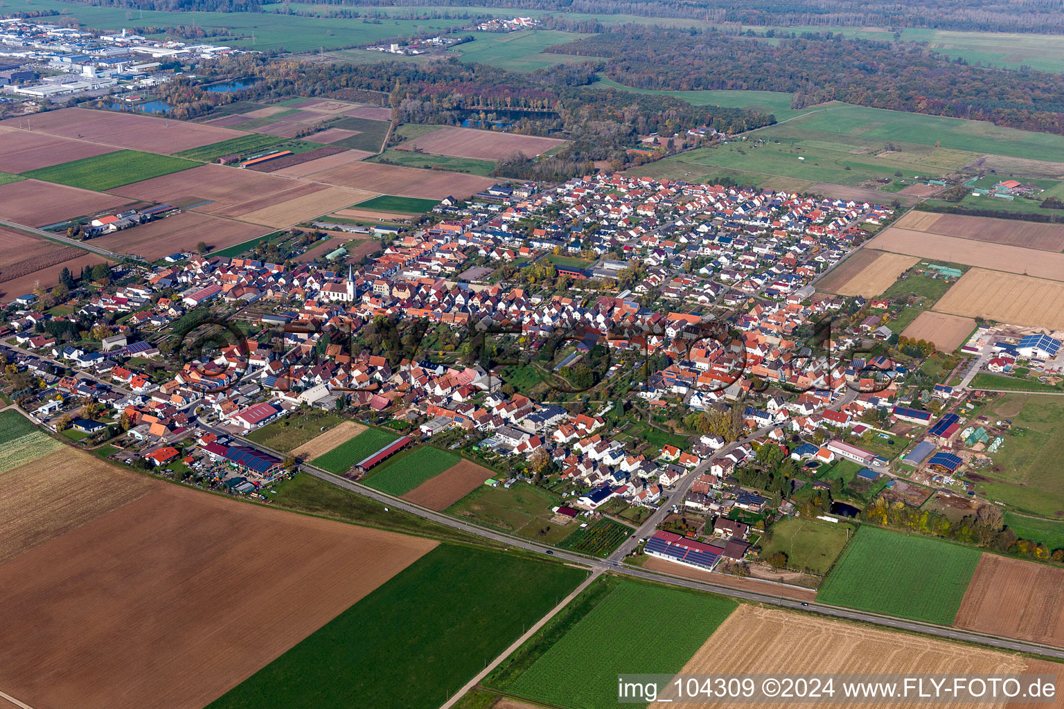 Aerial view of Village - view on the edge of agricultural fields and farmland in Ottersheim bei Landau in the state Rhineland-Palatinate, Germany