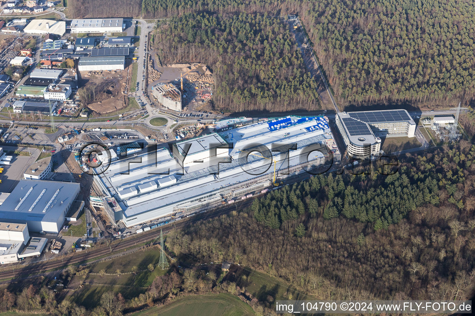 Extension - new building - construction site on the factory premises of SEW-EURODRIVE GmbH & Co KG in Graben-Neudorf in the state Baden-Wurttemberg, Germany from above