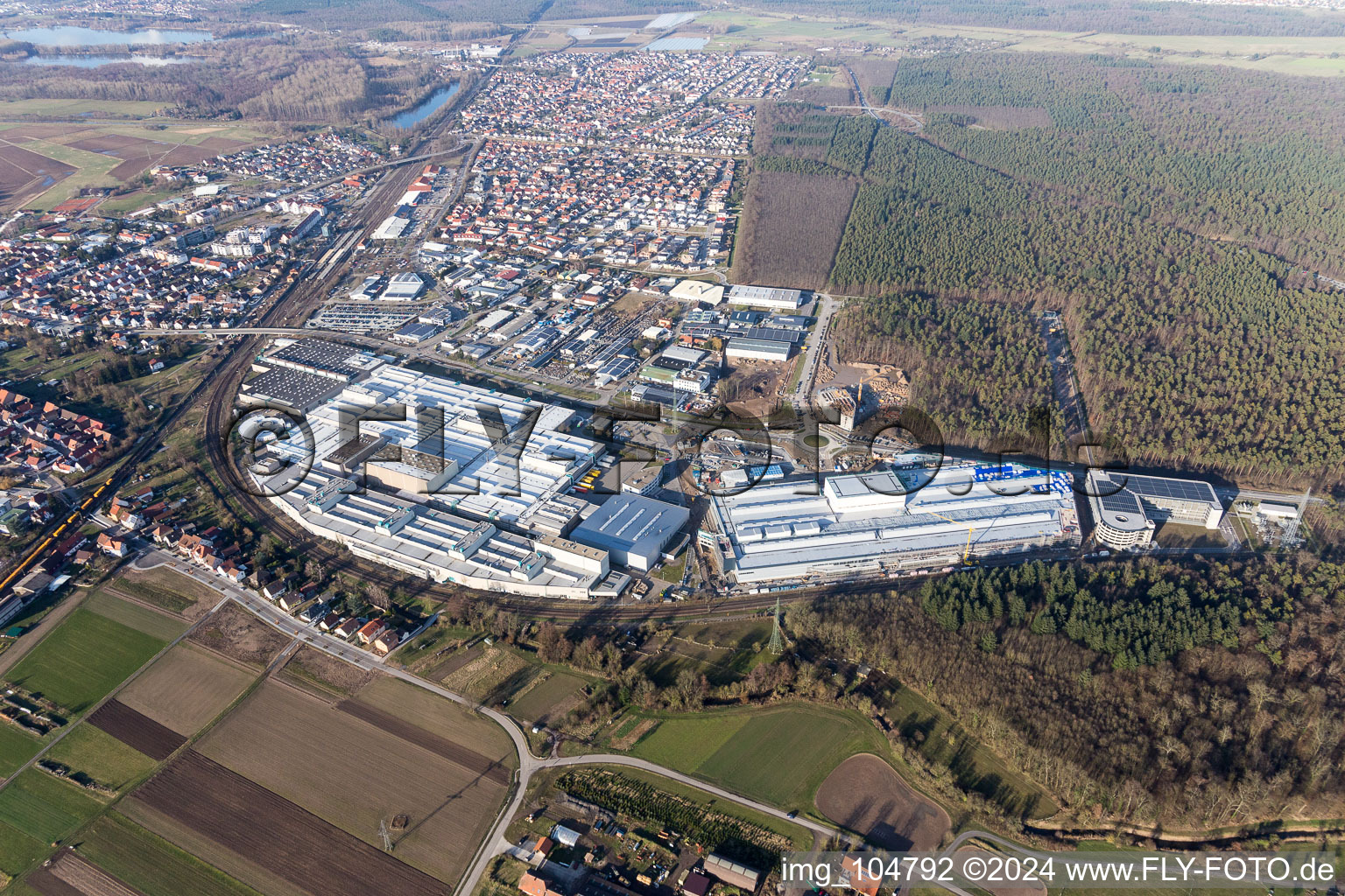 Extension - new building - construction site on the factory premises of SEW-EURODRIVE GmbH & Co KG in Graben-Neudorf in the state Baden-Wurttemberg, Germany seen from above