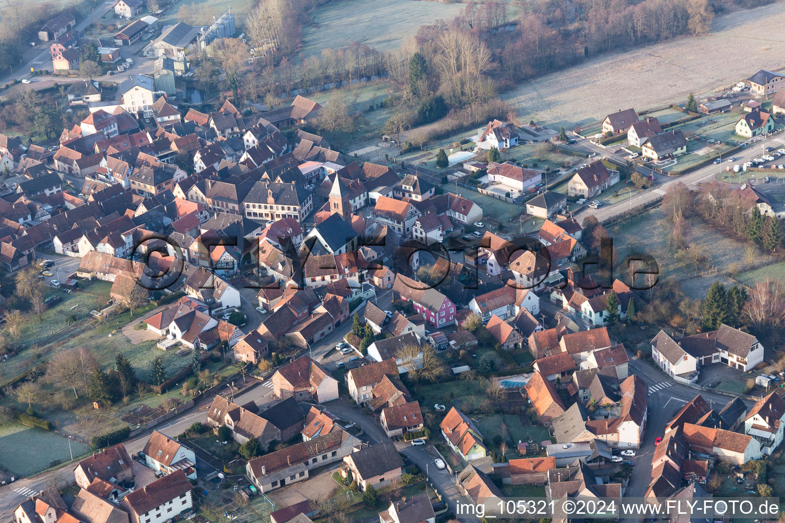 Protestantic Church building in the center of a circle of houses in the village of in Dossenheim-sur-Zinsel in Grand Est, France